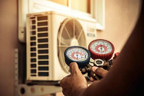 Professional Heat Pump Repair technician working in Portland, IN